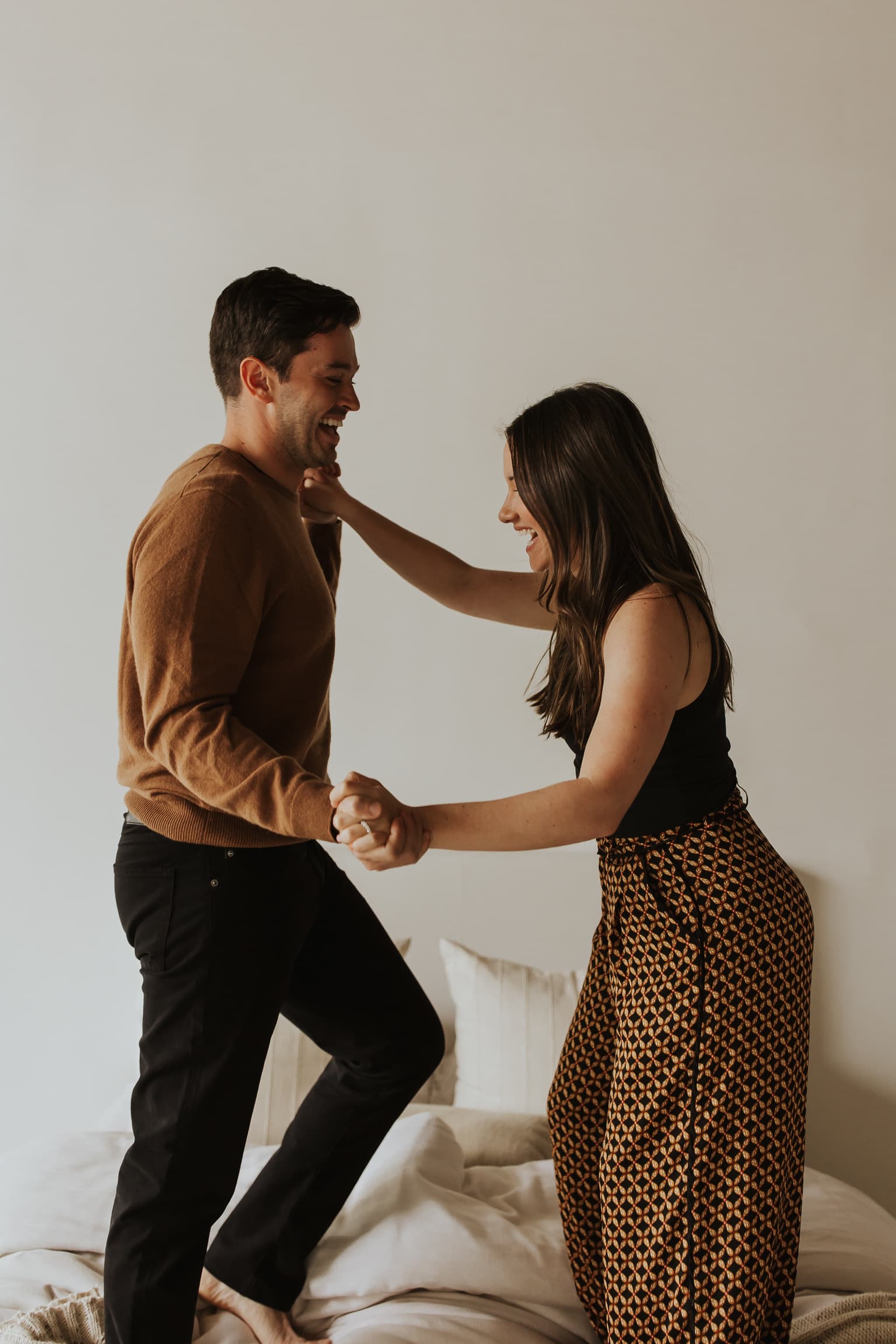 A photo of Molly and John soft smiling from their engagement photo shoot